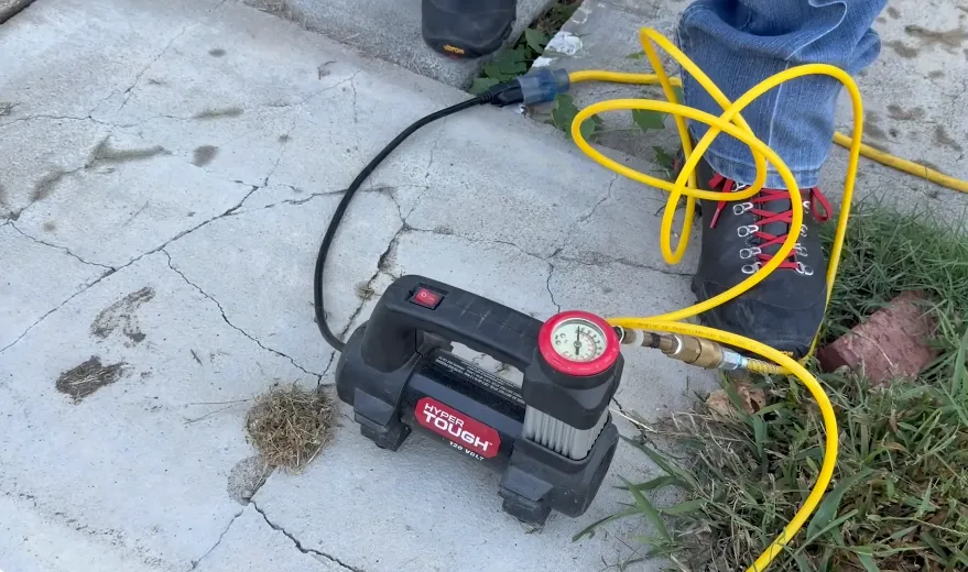 Air injection and pressure gauge used to locate an underground leak