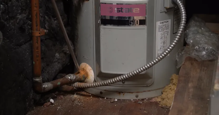 Inspecting a residential water heater for leaks